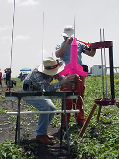 Pink two staged rocket on the pad