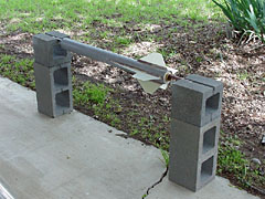 Painting stand for rockets made from cinder blocks